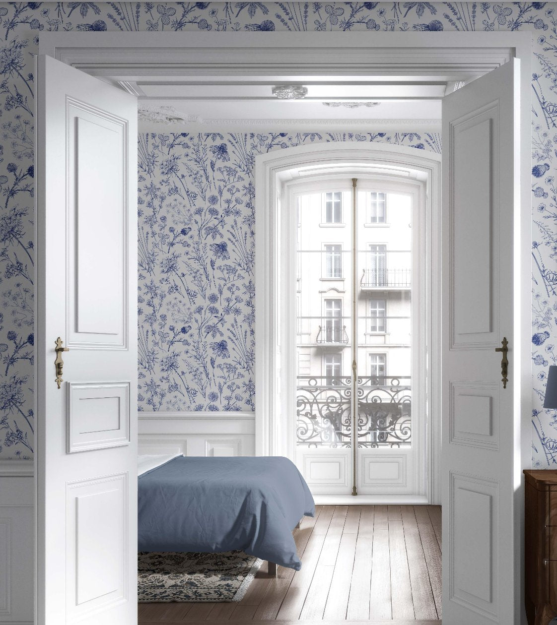 The bedroom features a blue and white floral wallpaper, creating a calming and elegant backdrop for the space.