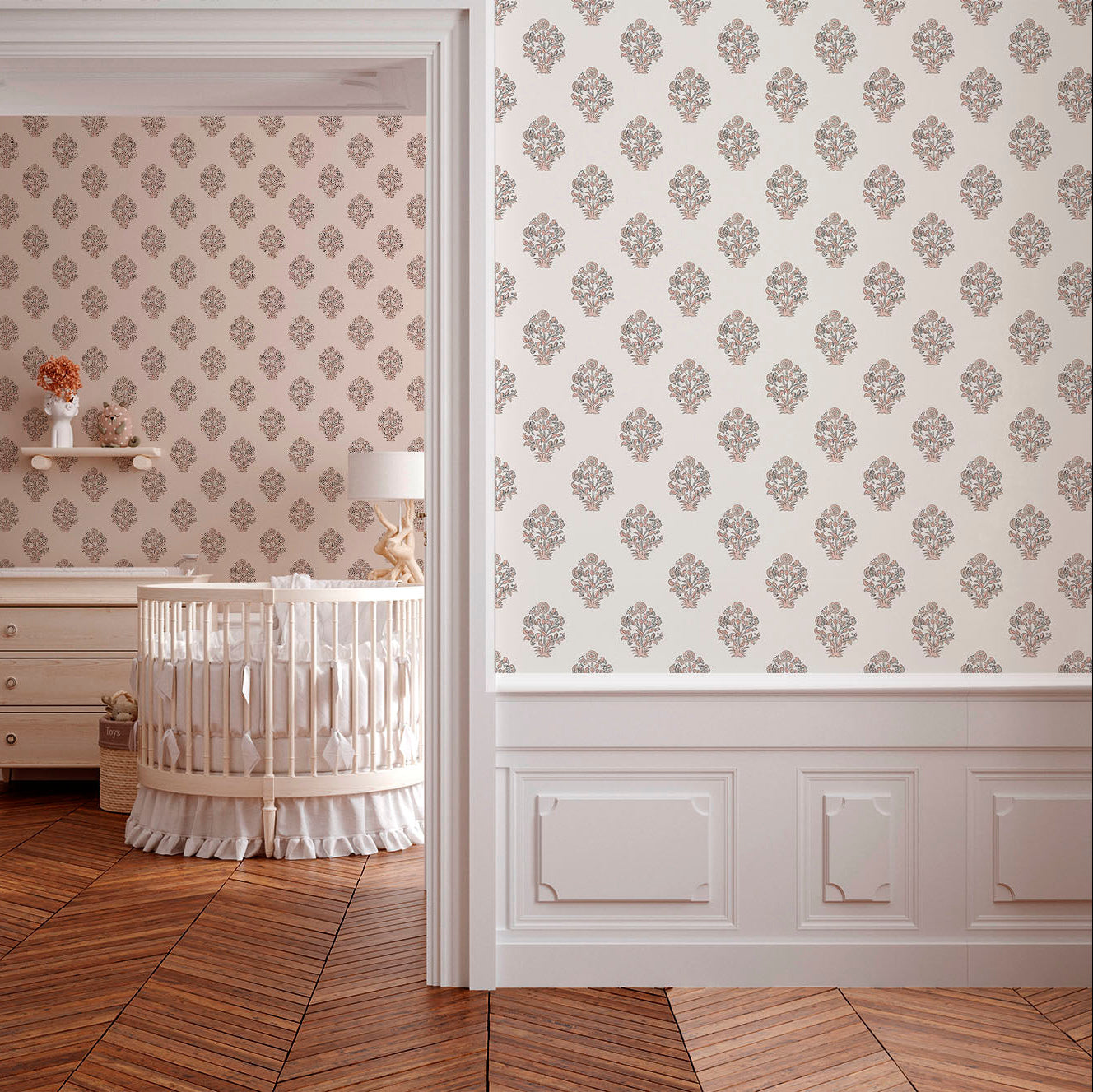 A serene nursery featuring floral patterned wallpaper, a wooden crib, and a light lamp. The room has warm wooden flooring and a cozy ambiance.