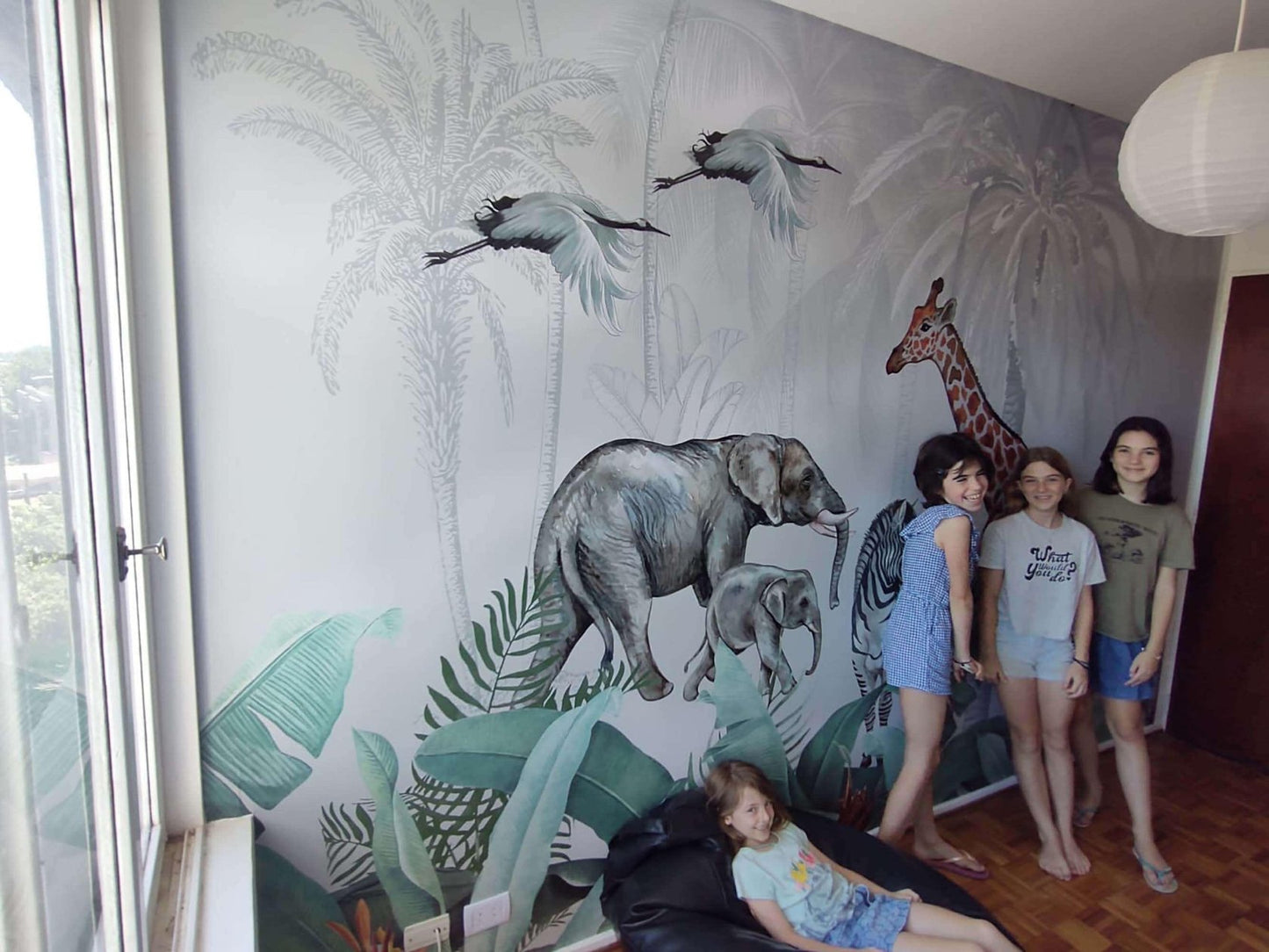 Tropical wallpaper installed in a childrens bedroom