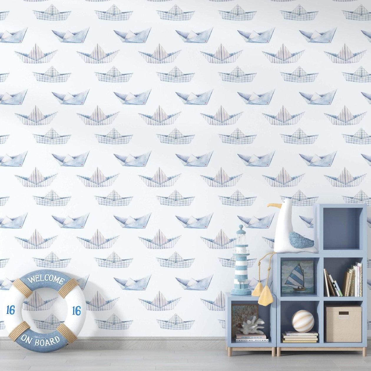 Nautical-themed wallpaper in blue and white, adorned with various boat designs for a coastal aesthetic.