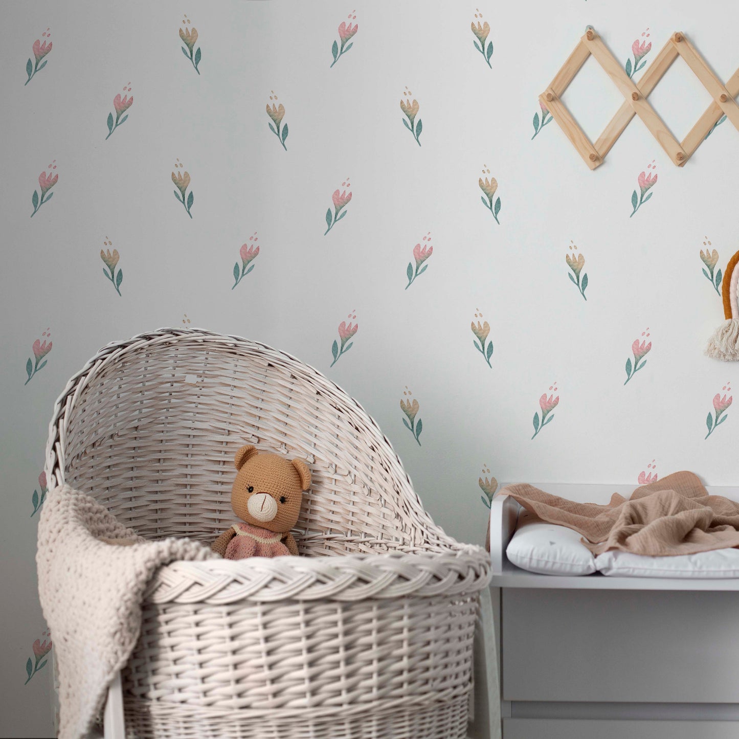 baby-toys-arrangement-indoors_with delicate floral wallpaper