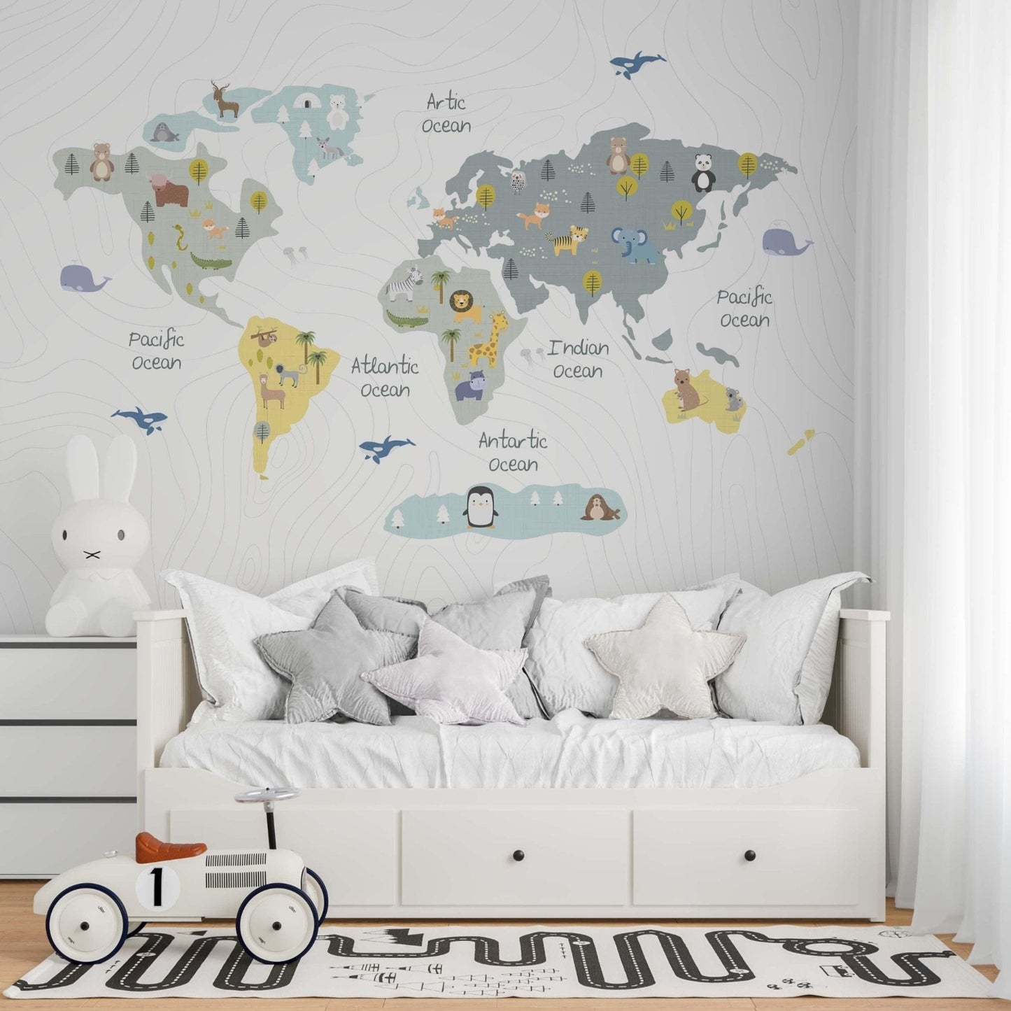 children´s bedroom with a wallpaper mural with animals
