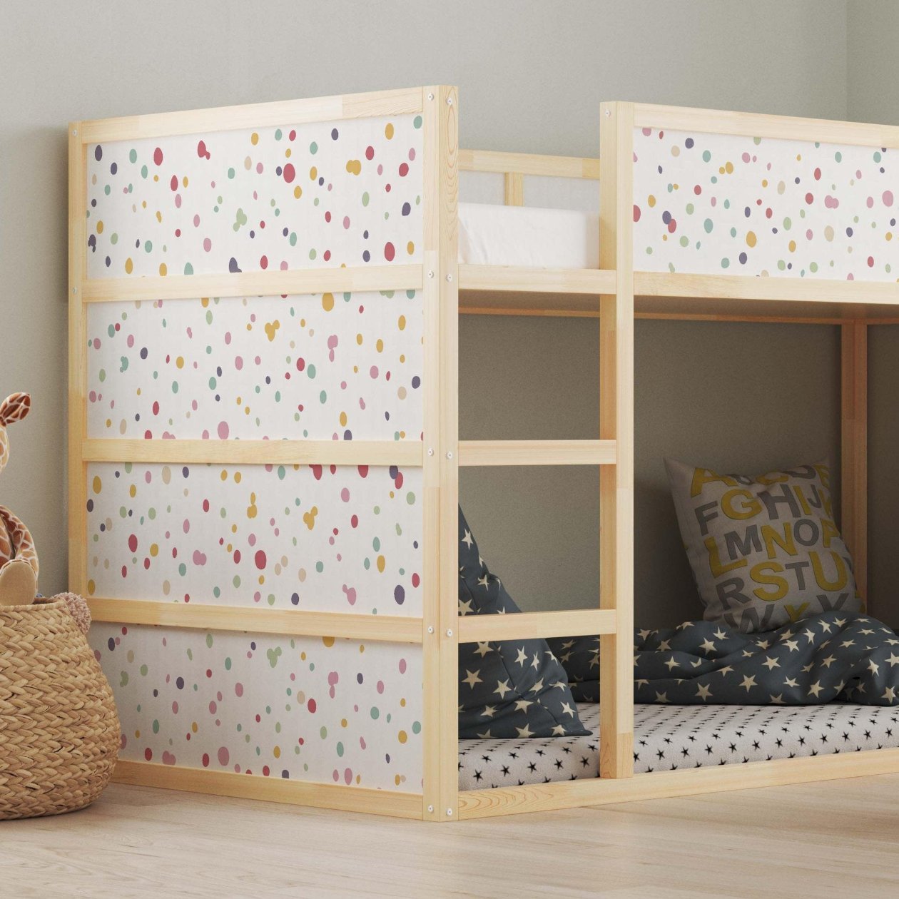 Kura bed with colorful dot decals in a children's bedroom, featuring cozy bedding, decorative pillows, and a small wooden table with chairs.