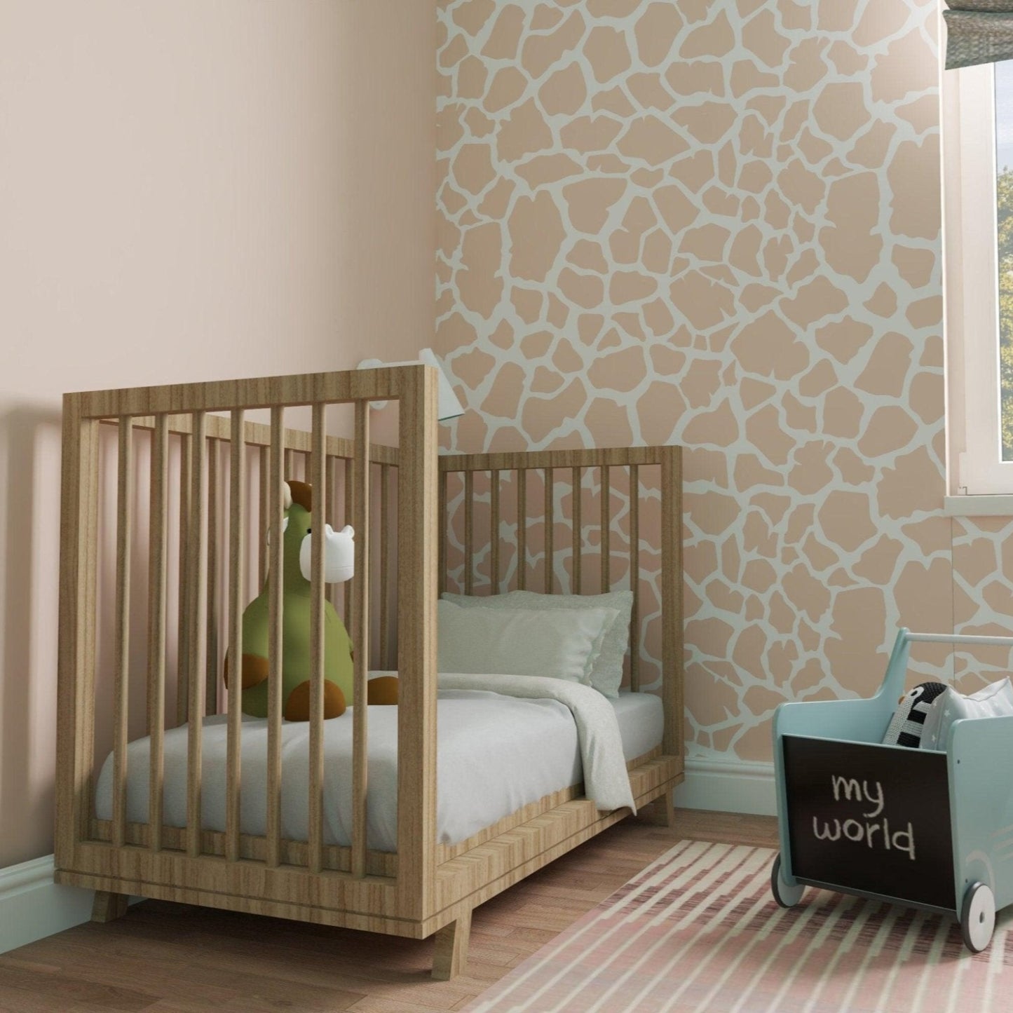giraffe animal print wallpaper in nursery with a wooden crib