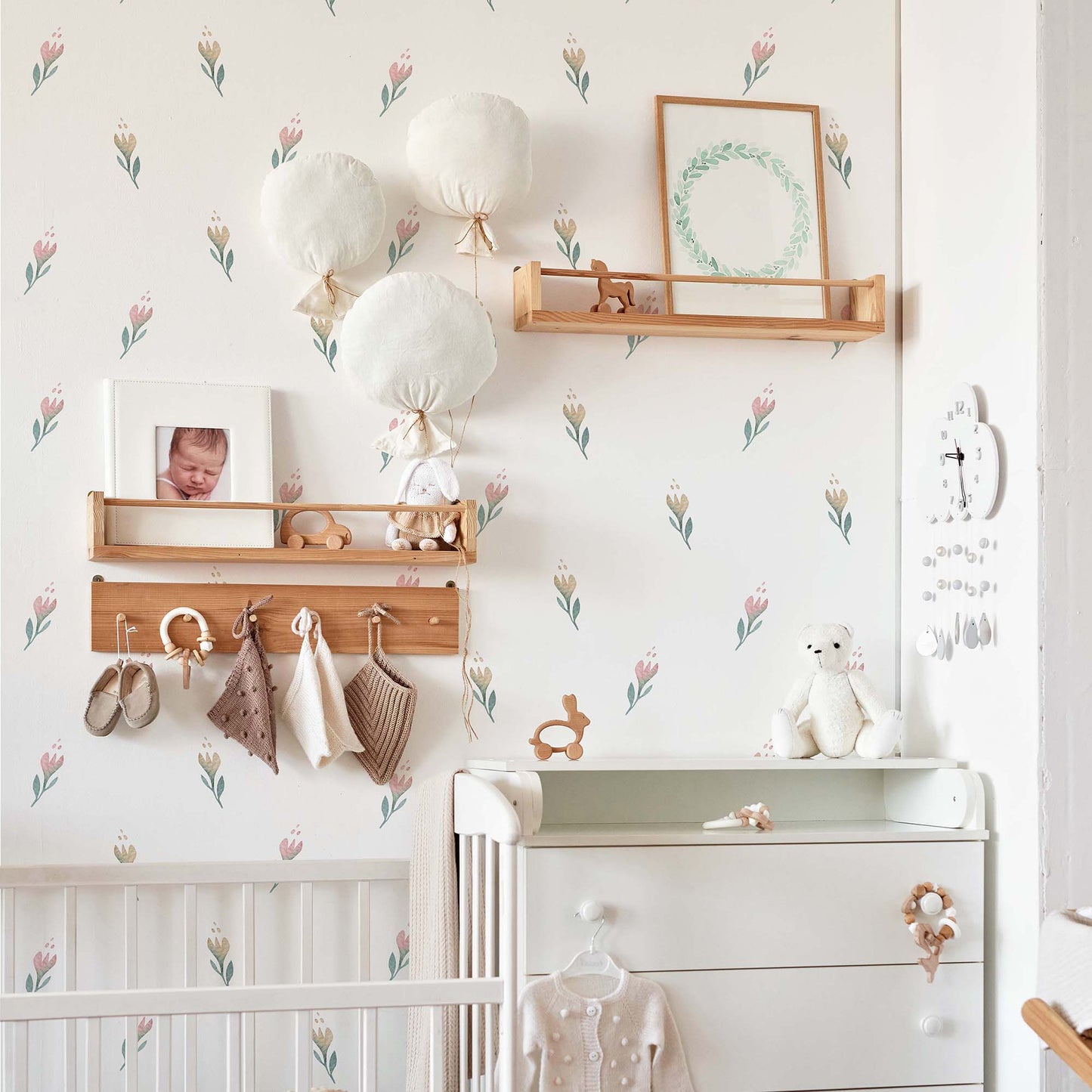 nursery interior wooden toys children´s room with pink flowers wallpaper