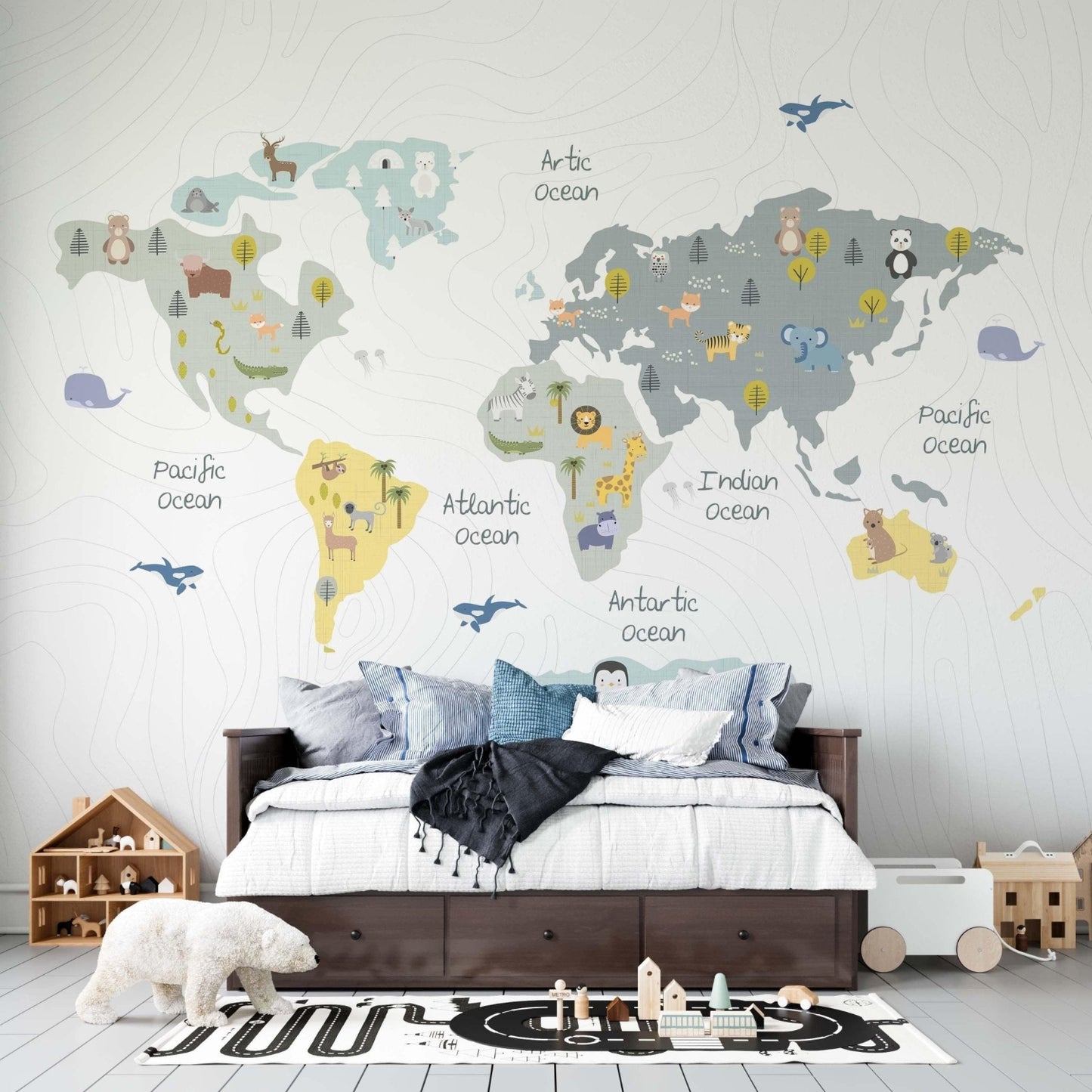 pastel color world map wallpaper mural in a kids bedroom with a brown bed