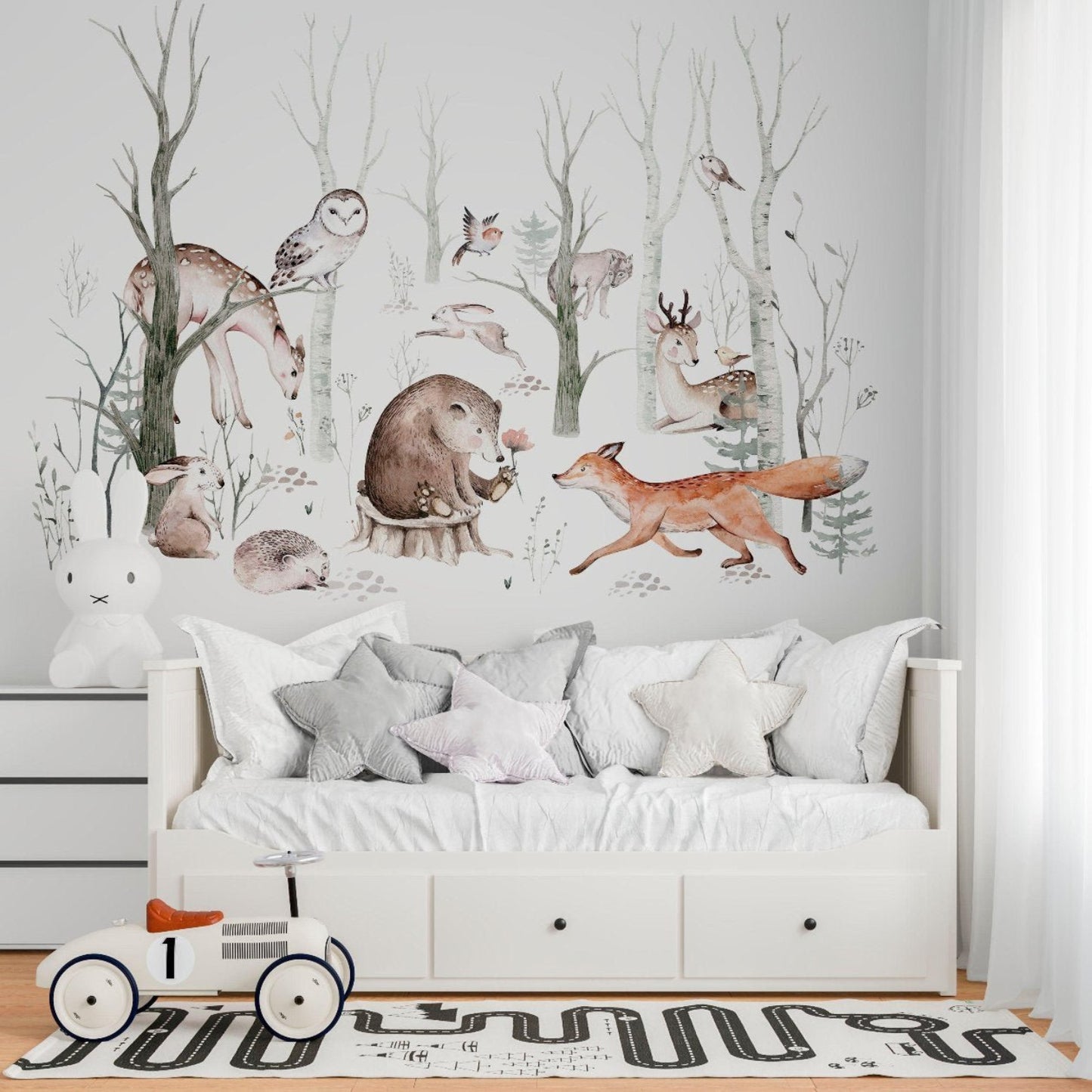 A watercolor mural of a serene snowy forest. Tall trees are covered in snow, with soft shades of blue and white blending into the background. Forest animals like deer, foxes, and rabbits are scattered throughout the scene. Birds are perched on snow-laden branches, and animal footprints can be seen in the snow. The overall mood is calm and peaceful, with delicate watercolor strokes and subtle shading adding a dreamy, wintry feel.