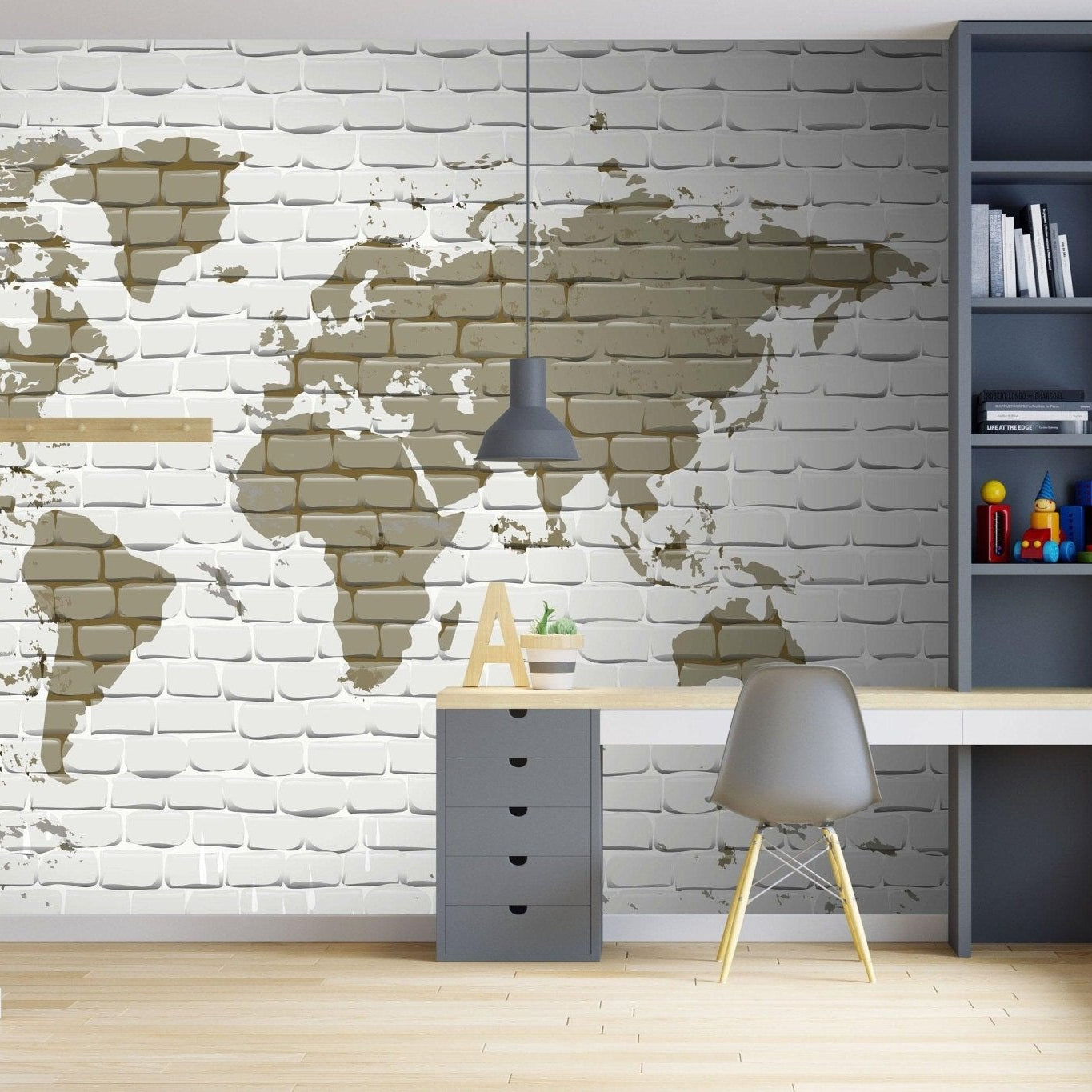 A bedroom for a teenager with a grey desk and library. A big world map mural in brown hues as an accent.