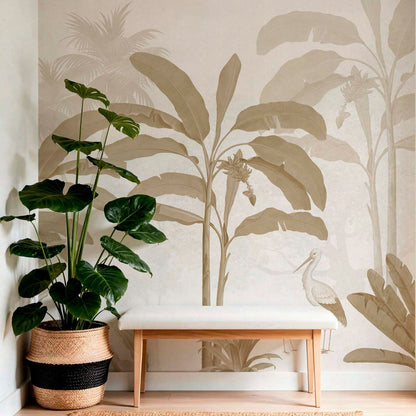 Beige tropical entryway wall mural featuring neutral banana leaves and a bird