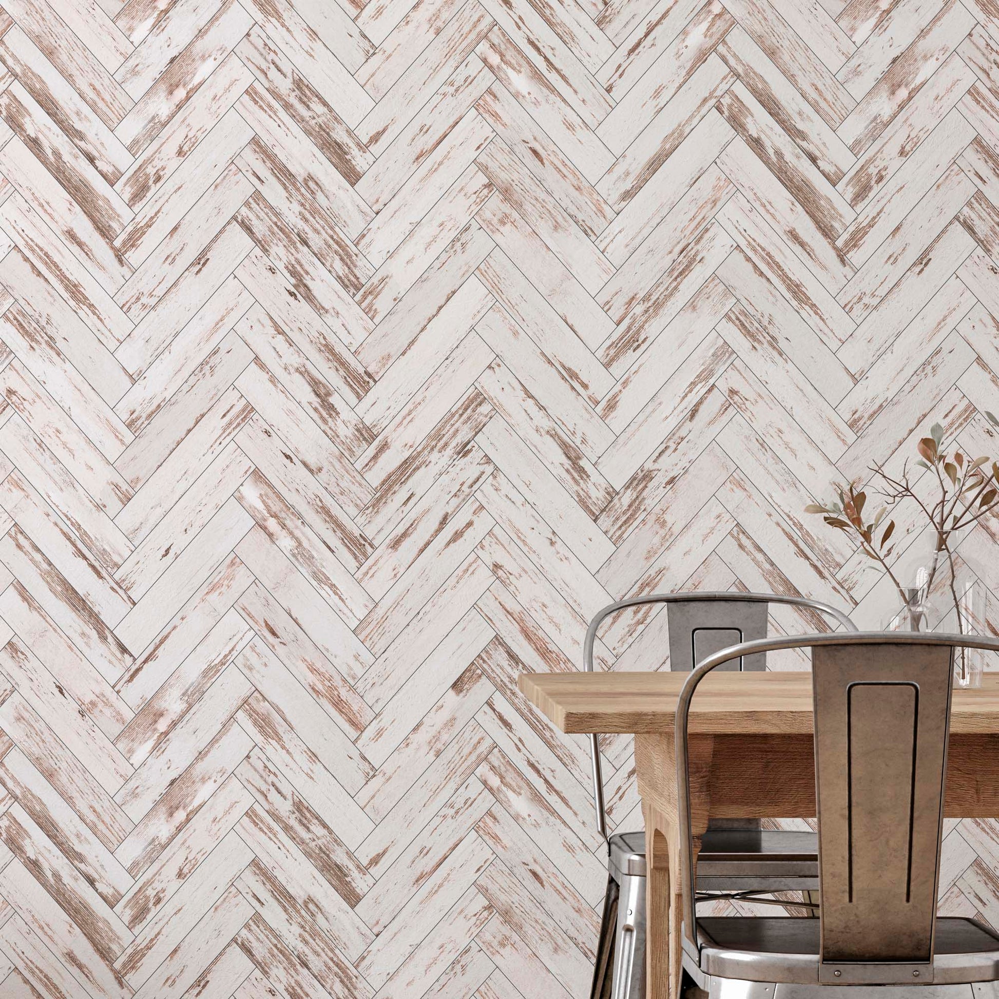 Industrial dining room with white herringbone faux wood wallpaper, wooden table, and metal chairs.