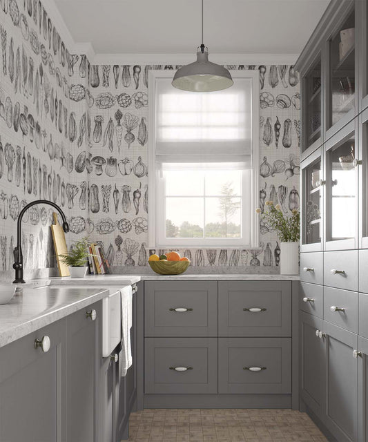 Vegetable black and white wallpaper in a french style kitchen with grey cabinets