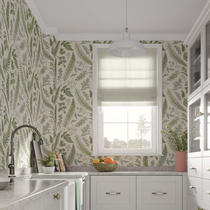Classic french style kitchen with white cabinets and a tropical wallpaper featuring fern leaves on a beige background.