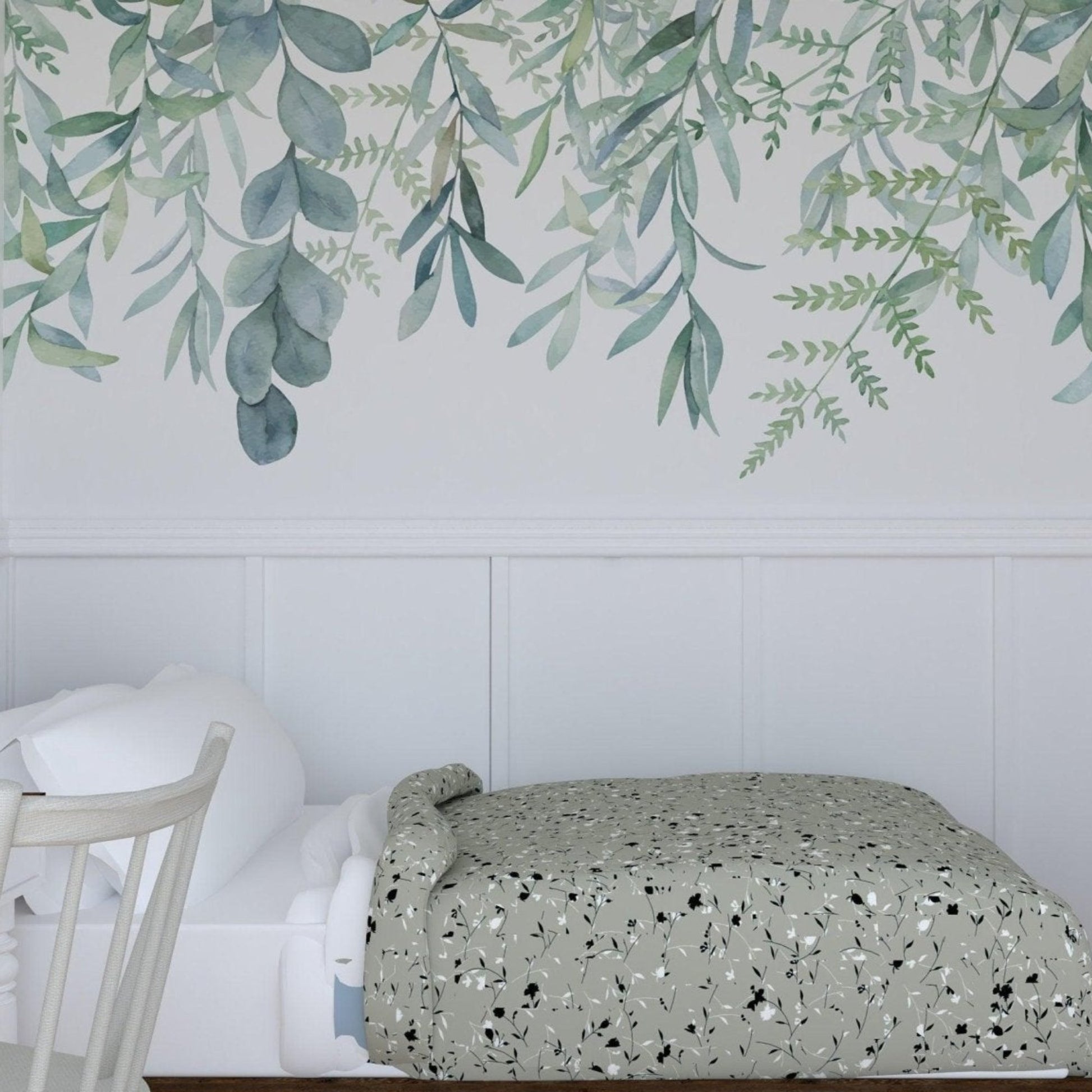 Hanging leaves wallpaper in bedroom with a white wood wainscot