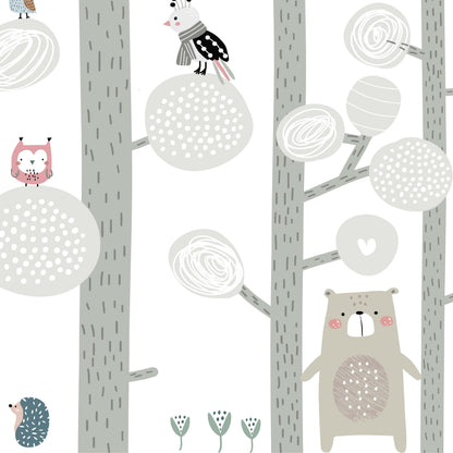 Detail of Happy Forest mural showing illustrated owls, bears, birds and hedgehog in soft gray and blush pink tones