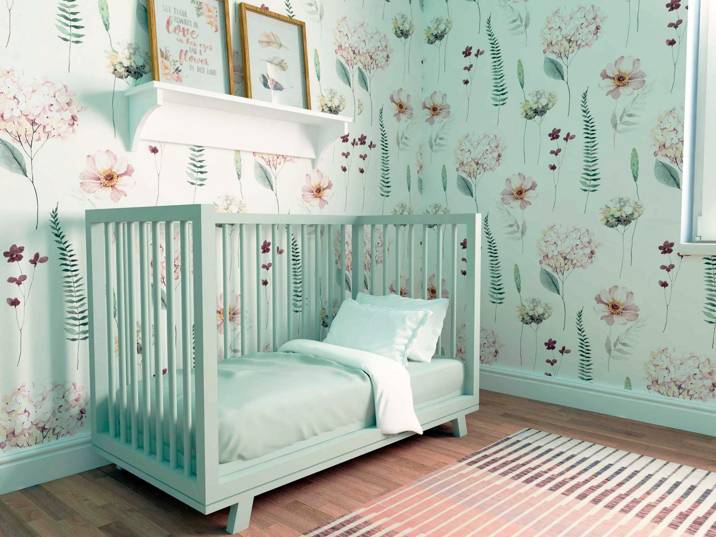A close-up of a nursery corner with a grey crib and white linens. The Hydrangea watercolor wallpaper provides a soft backdrop with its floral design.