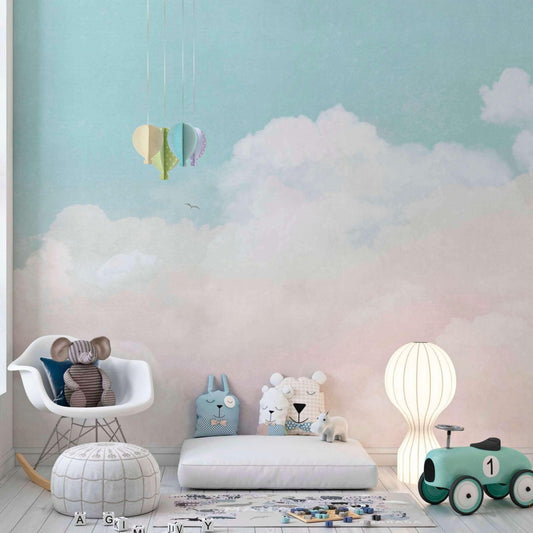 Pink and blue cloud wallpaper in a nursery bedroom decor