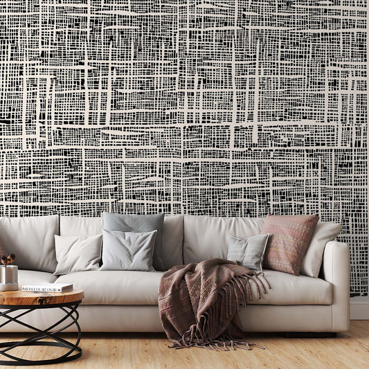 cat-610569683272   Modern living room featuring a large black and white abstract grid wall mural behind a white sofa.
