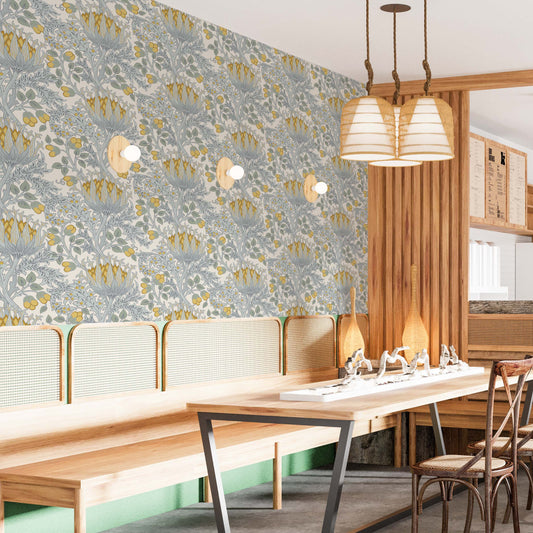 cat-659356549448 Modern dining area with a long wooden table and chairs featuring a vintage mustard and grey floral wallpaper as a feature wall.
