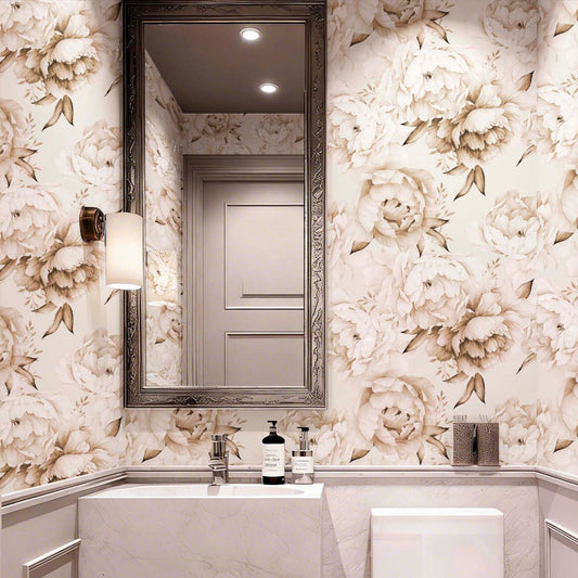 cat-610804236616 Elegant bathroom interior featuring beige watercolor peony wallpaper, a large silver framed mirror, marble vanity, and classic wall sconce lighting.
