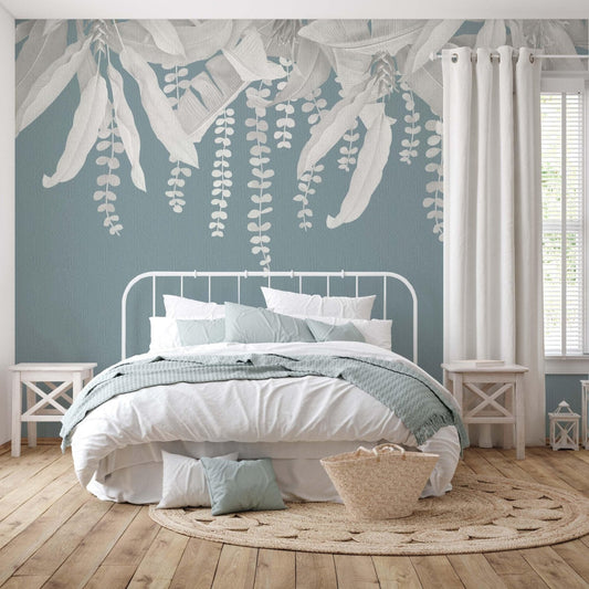 big grey banana leaves over a teal background in master bedroom