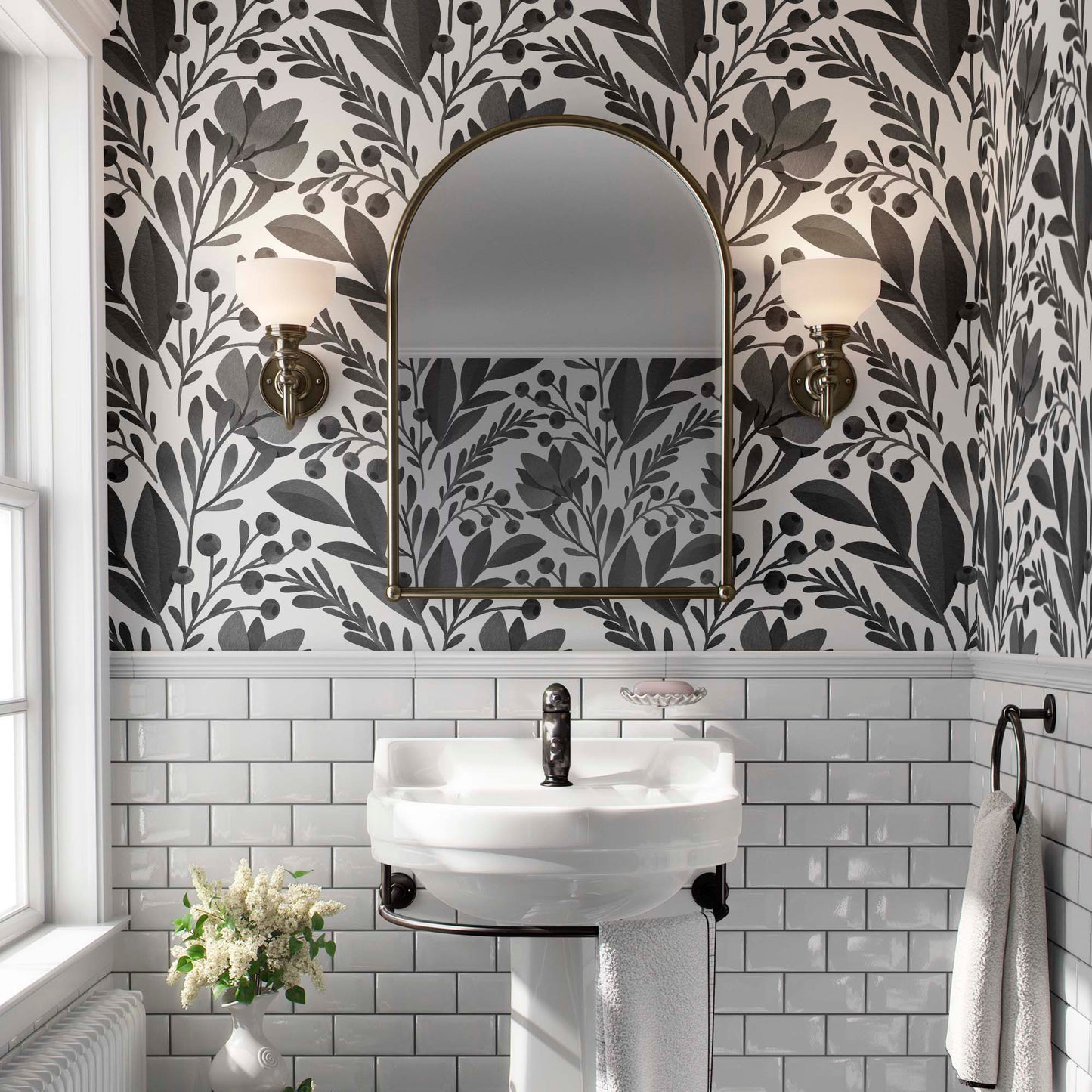 cat-610804236616 Large-scale black and white floral pattern with stylized leaves and flowers above white subway tiles in a classic bathroom setting.
