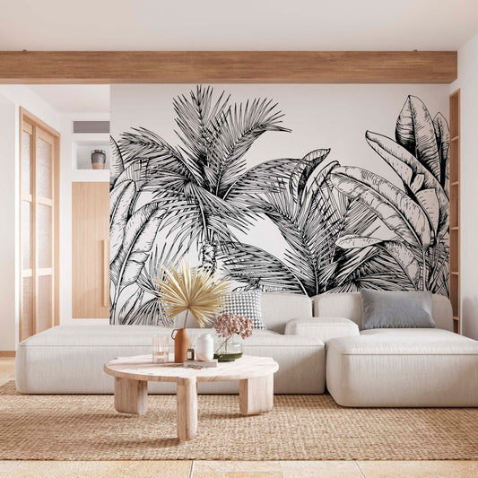 cat-610569683272 Modern living room with a large black and white tropical palm leaf wall mural behind a white sectional sofa.