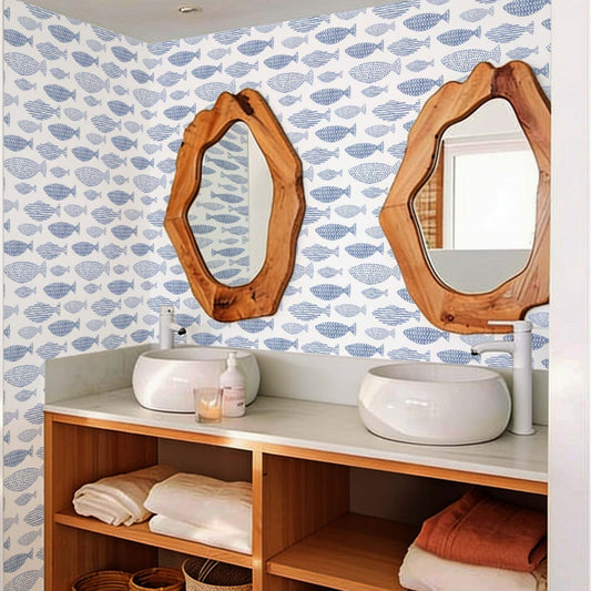 cat-610804236616 Blue fish wallpaper in a bright bathroom with a natural wood vanity, white vessel sinks and organic wood mirrors.
