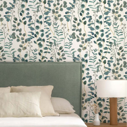 cat-616983200072 Blue green eucalyptus wallpaper in a cozy bedroom with upholstered bed, natural wood furniture and soft neutral bedding.