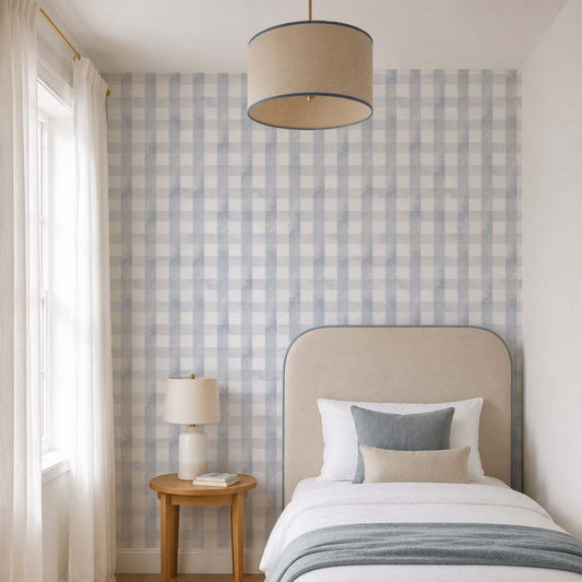 cat-615198294344 Blue grey gingham wallpaper in a bright children's bedroom with an upholstered single bed, light oak furniture and soft neutral textiles.