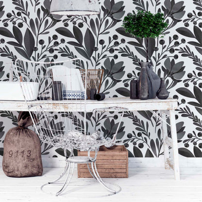 at-610804433224 Dark charcoal botanical leaf and berry pattern on a white background in a studio setting with metal and rustic wood furniture.