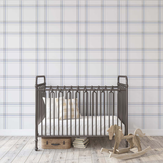 Timeless blue and gray plaid tartan wallpaper in a classic nursery room with a vintage metal crib and wooden rocking horse.