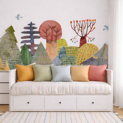  Magical forest kids mural wallpaper in a children's bedroom with white bed and colorful cushions, illustrated geometric trees in watercolor style