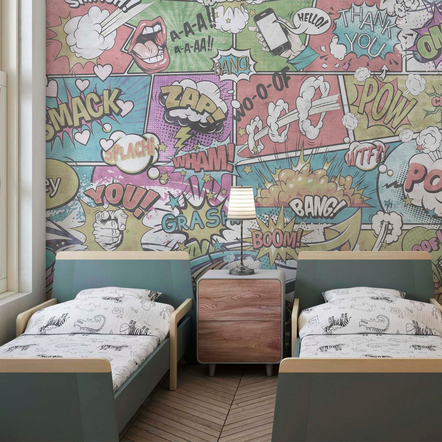A children's bedroom featuring twin beds with teal headboards and a comic book-style mural background with colorful action bubbles and sound effects.