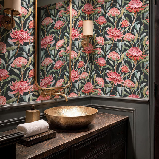 Dark floral wallpaper with pink protea flowers in an elegant bathroom