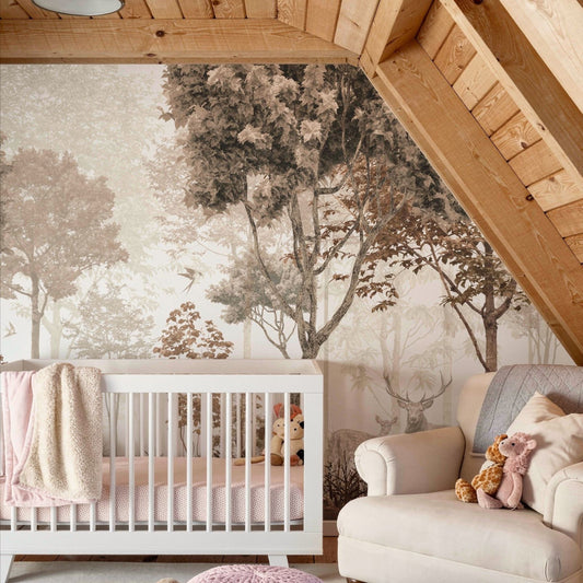 Nursery with enchanted forest wallpaper mural featuring misty trees, birds, and deer, paired with a white crib and wooden ceiling beams.