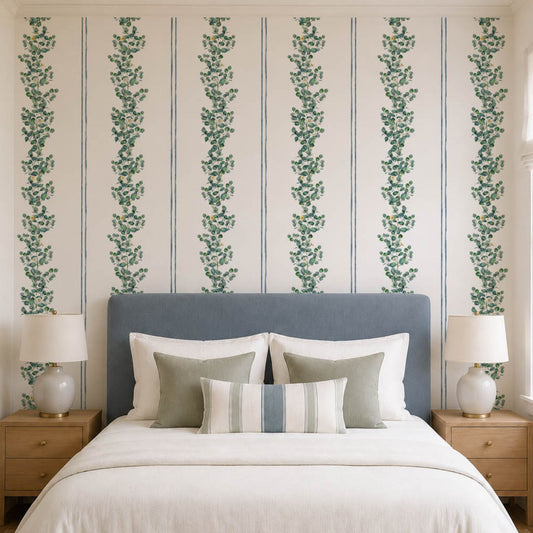cat-616983200072 Blue and green striped eucalyptus wallpaper behind a bed with a blue upholstered headboard