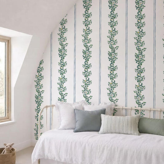 Eucalyptus and daisy striped wallpaper on a sloped attic ceiling in a kids' daybed room