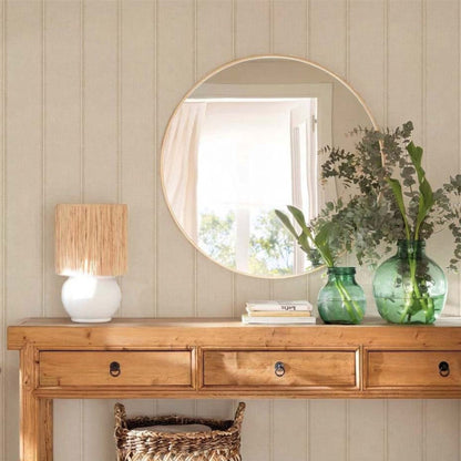 cat-659356549448 Entryway with French Linen Stripe wallpaper, pine console table, round mirror and green glass vases