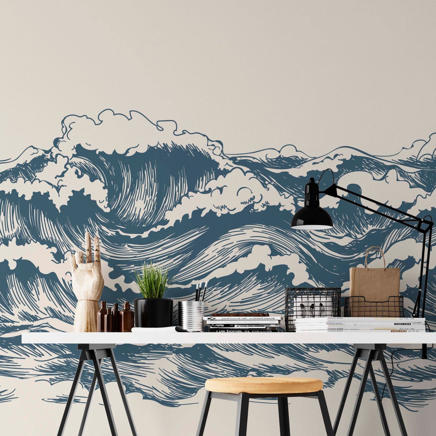 cat-660961526088 Great Wave wallpaper mural behind a studio desk with blue graphic waves on beige background, industrial lamp and black metal accessories