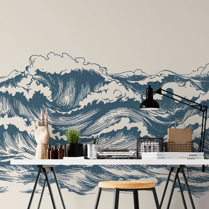 cat-660961526088 Great Wave wallpaper mural behind a studio desk with blue graphic waves on beige background, industrial lamp and black metal accessories