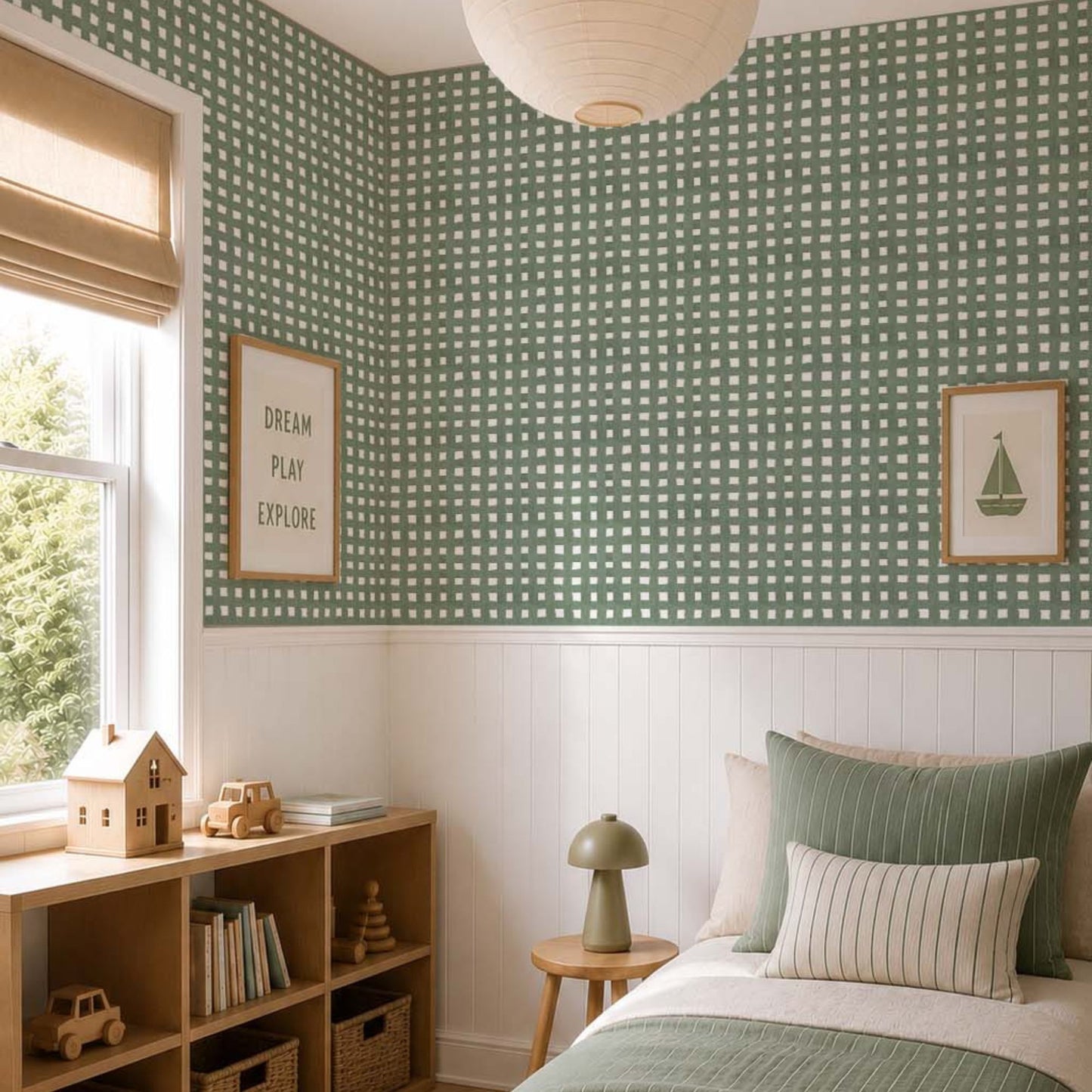 cat-615198294344 Scandinavian kids bedroom with sage green checkered wallpaper, white wainscoting, light oak furniture and olive green striped bedding.