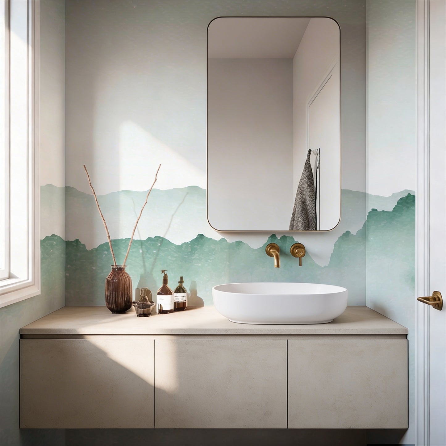 cat-610804236616 Decorative green watercolor ombre mist wallpaper mural on a bathroom wall with a modern white vessel sink, brushed gold faucet, and a rounded rectangle mirror.