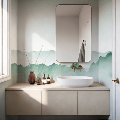 cat-610804236616 Decorative green watercolor ombre mist wallpaper mural on a bathroom wall with a modern white vessel sink, brushed gold faucet, and a rounded rectangle mirror.