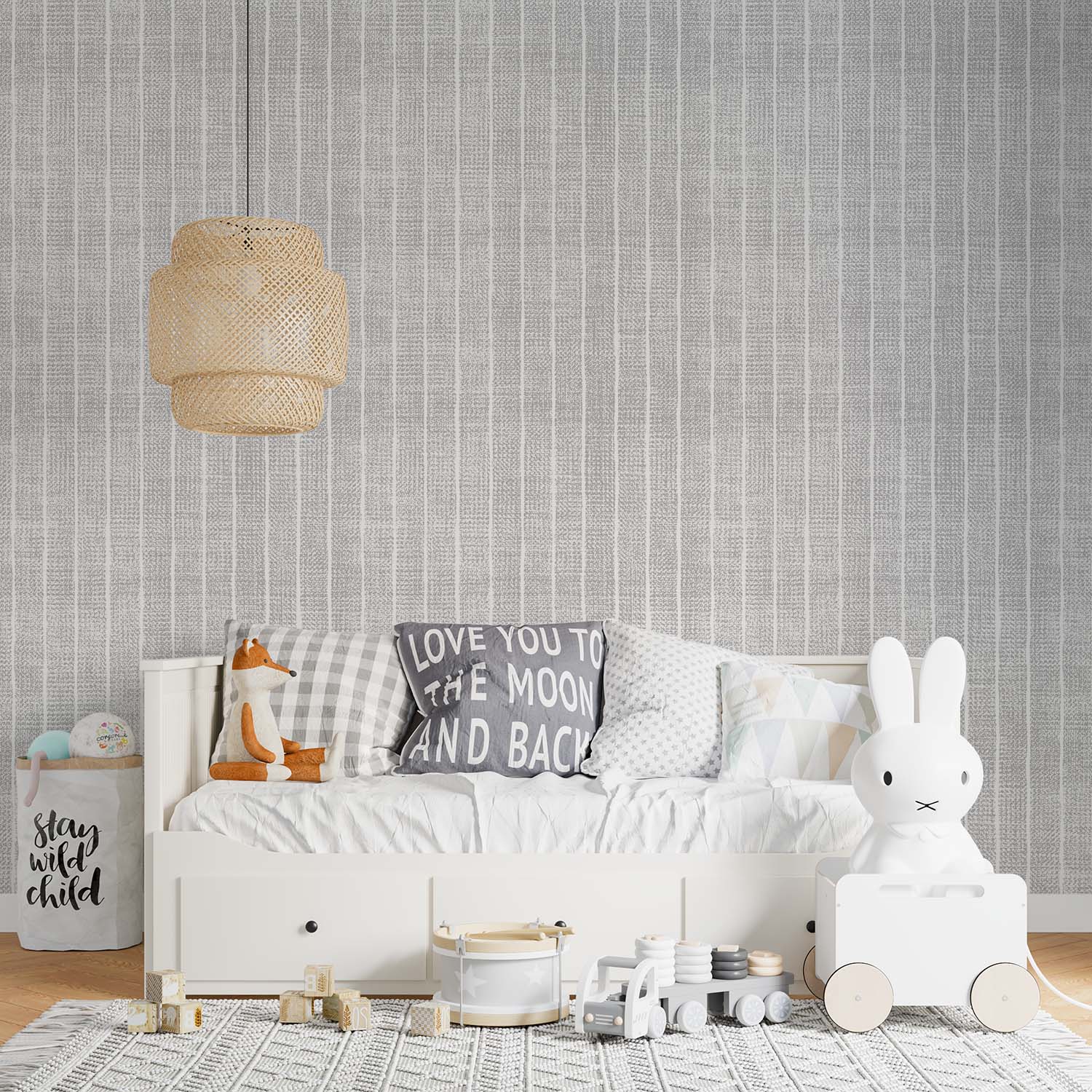 cat-615198294344 Light grey and white textured stripe wallpaper in a Scandinavian-style kids' bedroom with a white daybed, wicker pendant lamp, and minimalist toys