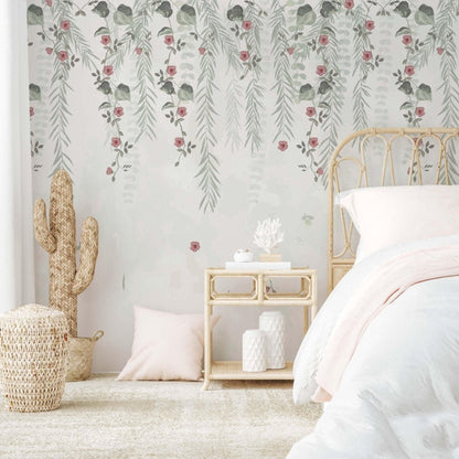 A serene bedroom showcasing a white bed against pink floral wallpaper, complemented by a small cactus on display.