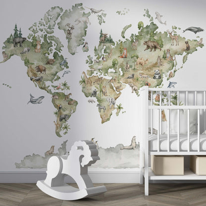 Decorative kids wallpaper featuring an illustrated world map with watercolor animals on a nursery wall behind a white wooden crib and next to a white rocking horse.