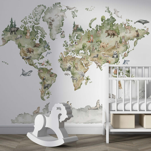 Decorative kids wallpaper featuring an illustrated world map with watercolor animals on a nursery wall behind a white wooden crib and next to a white rocking horse.