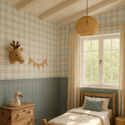 Soft blue and beige tartan plaid wallpaper covering the upper half of a child's bedroom wall, paired with a dusty blue wainscoting panel below