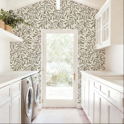 cat-615198490952 Green willow leaf wallpaper on a laundry room wall featuring white cabinetry and a grey washing machine.