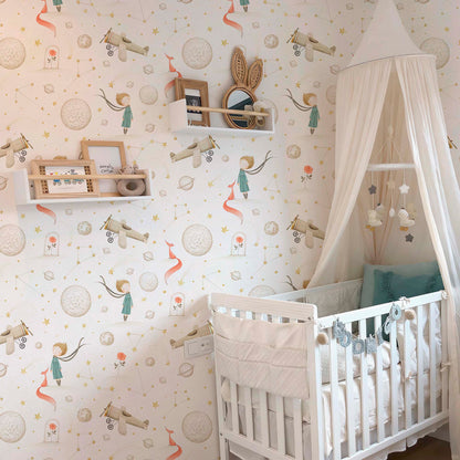 Cozy nursery with Little Prince wallpaper featuring watercolor planets, stars, and airplanes, styled with a white crib and soft canopy